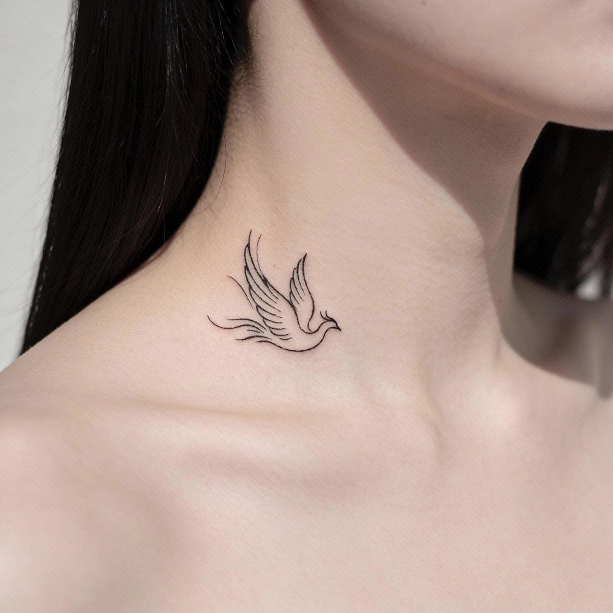 Small phoenix collarbone tattoo